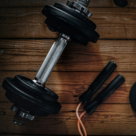 a pair of dumbbells, a towel and a pair of dumbbells