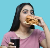 a woman eating a sandwich
